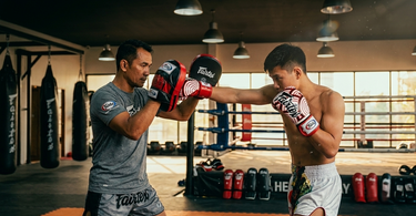 The Art of the Feed: How to Hold Focus Mitts Safely (Without Ruining Your Wrists)